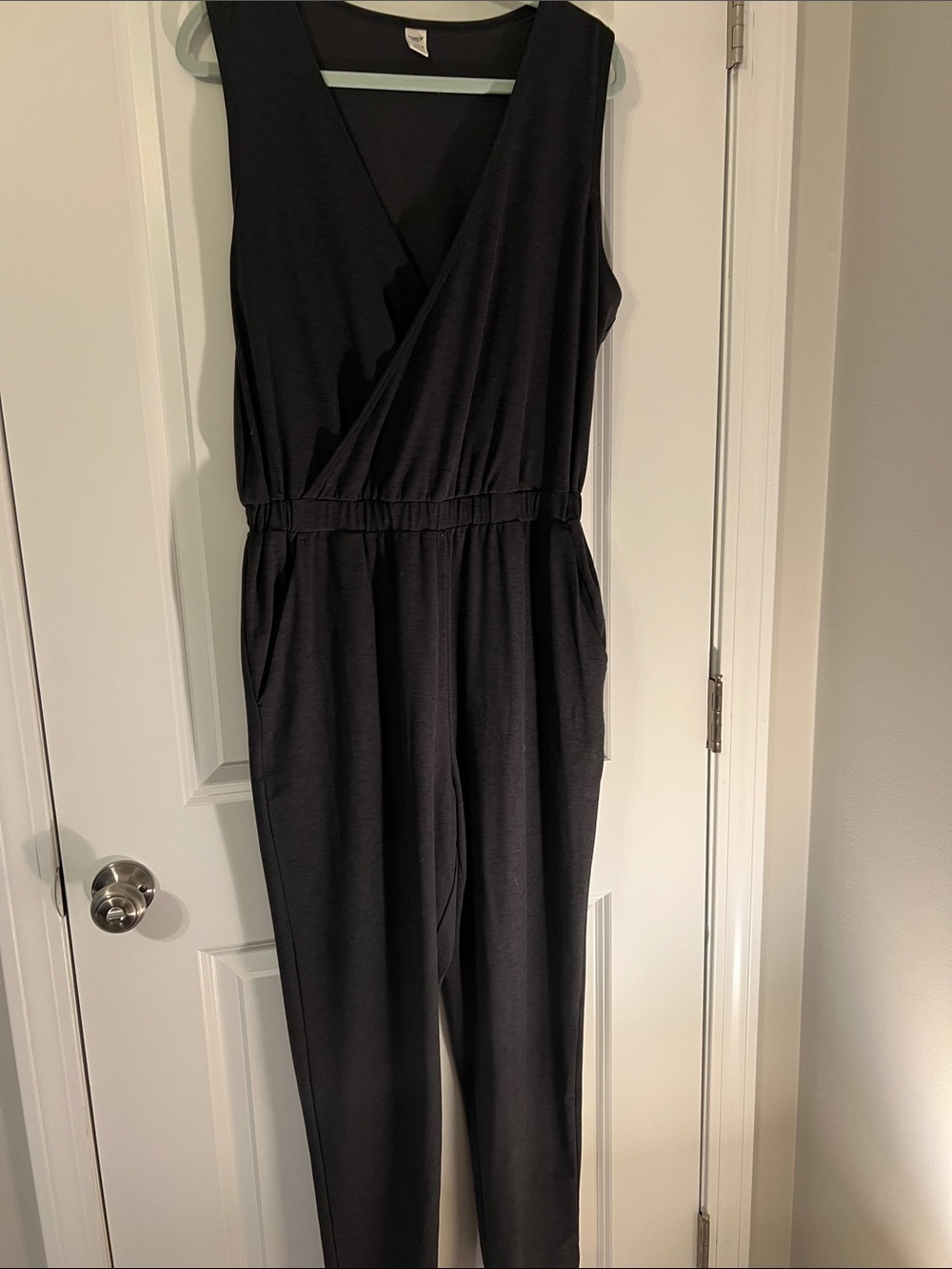 Active wear charcoal sleeveless V-Neck Jumpsuit with Elastic Waist and Pockets.
